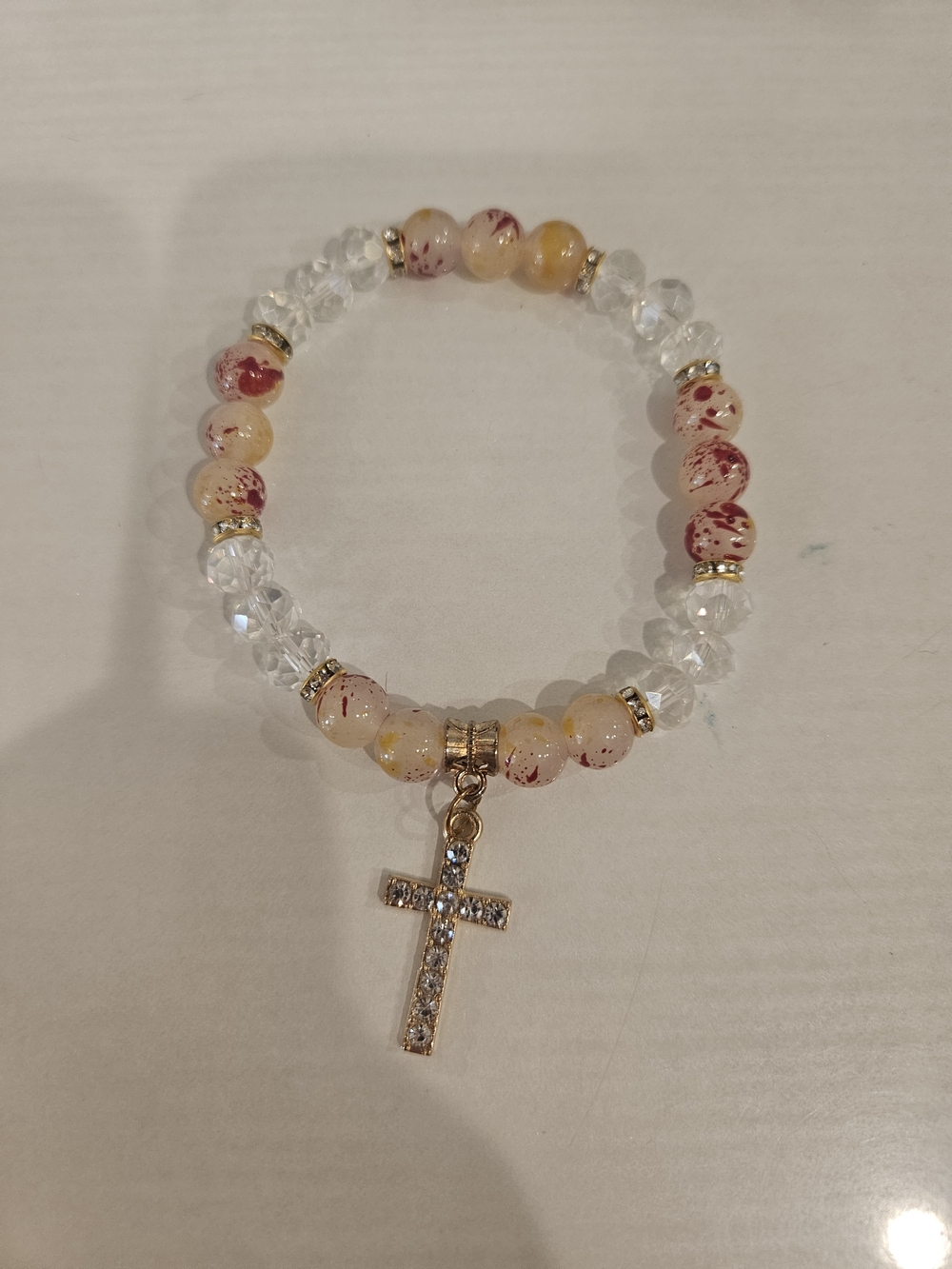 Gold Cross Charm Beaded Bracelet in Cream and Red Speckle